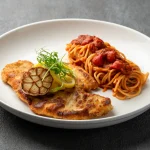 Crispy chicken alla Milanese served with fresh lemon wedges at Secret Oven Koh Samui