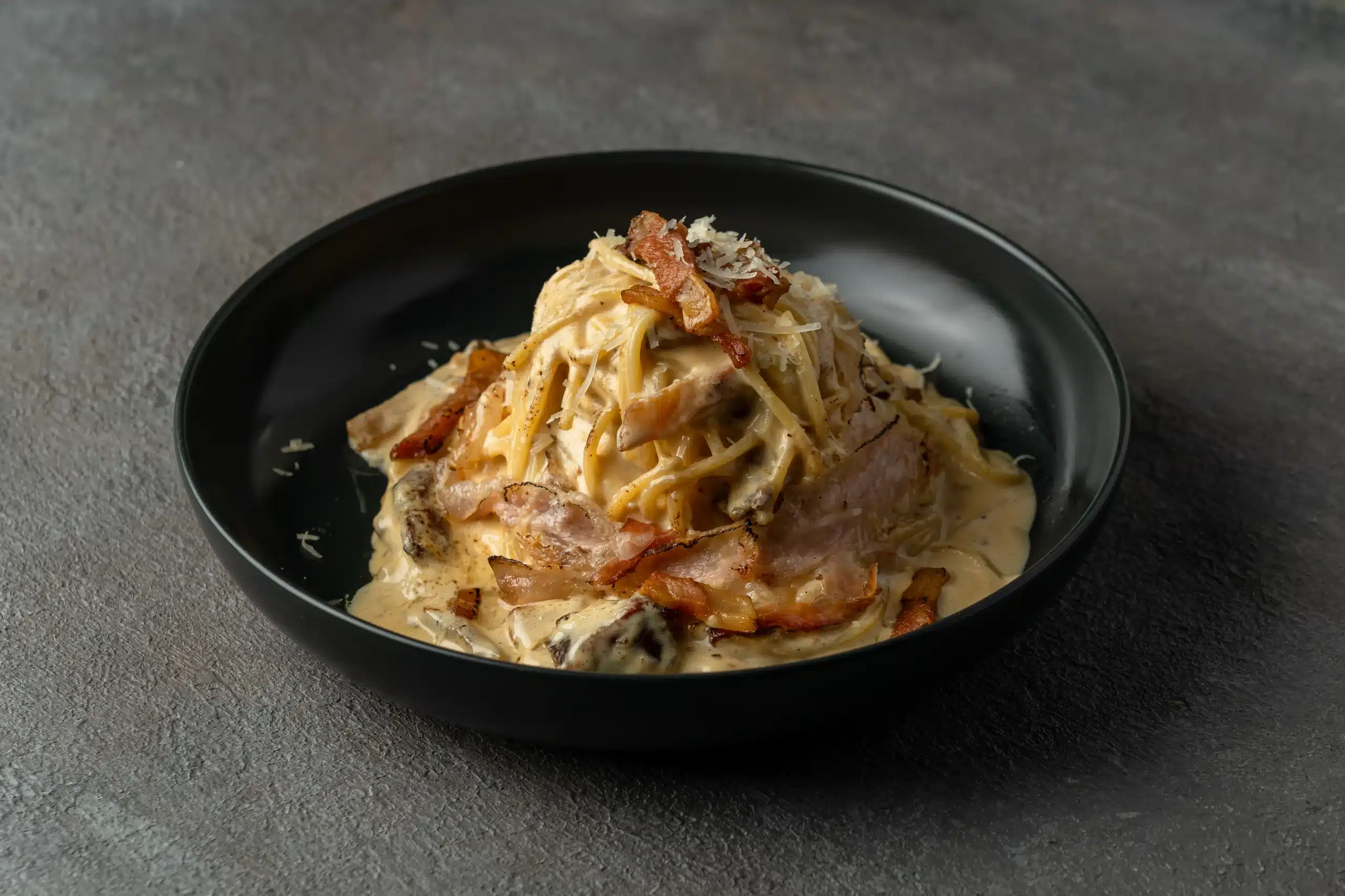 Authentic carbonara pasta made with guanciale and Pecorino Romano cheese at Secret Oven Koh Samui