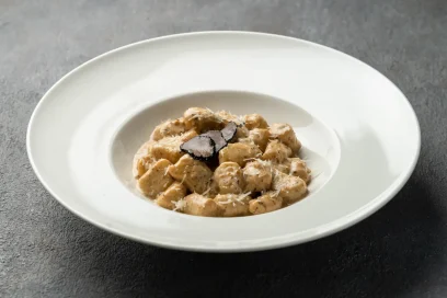 Close-up of gnocchi with rich porcini mushrooms and truffle aroma at Secret Oven Koh Samui