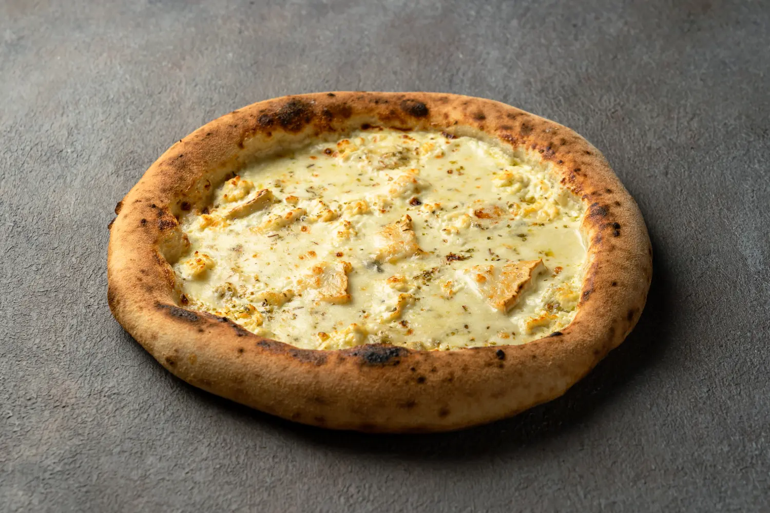 Homemade Pizza Formaggio topped with a blend of Italian cheeses at Secret Oven restaurant