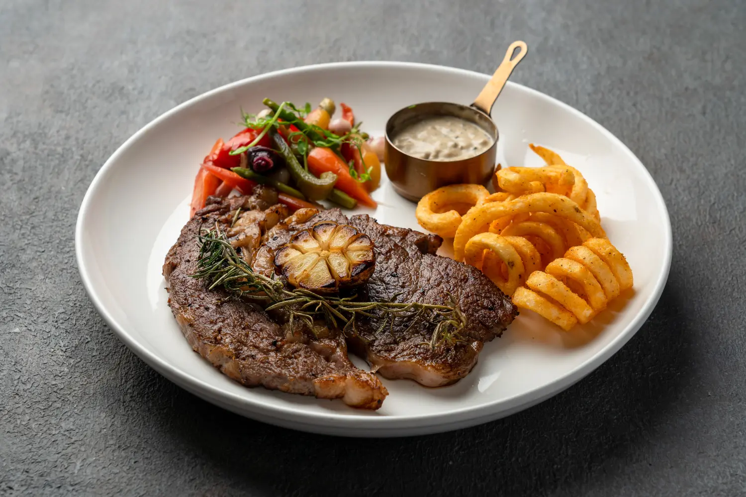 Pan-seared Australian Wagyu ribeye steak with garlic and thyme at Secret Oven, Koh Samui